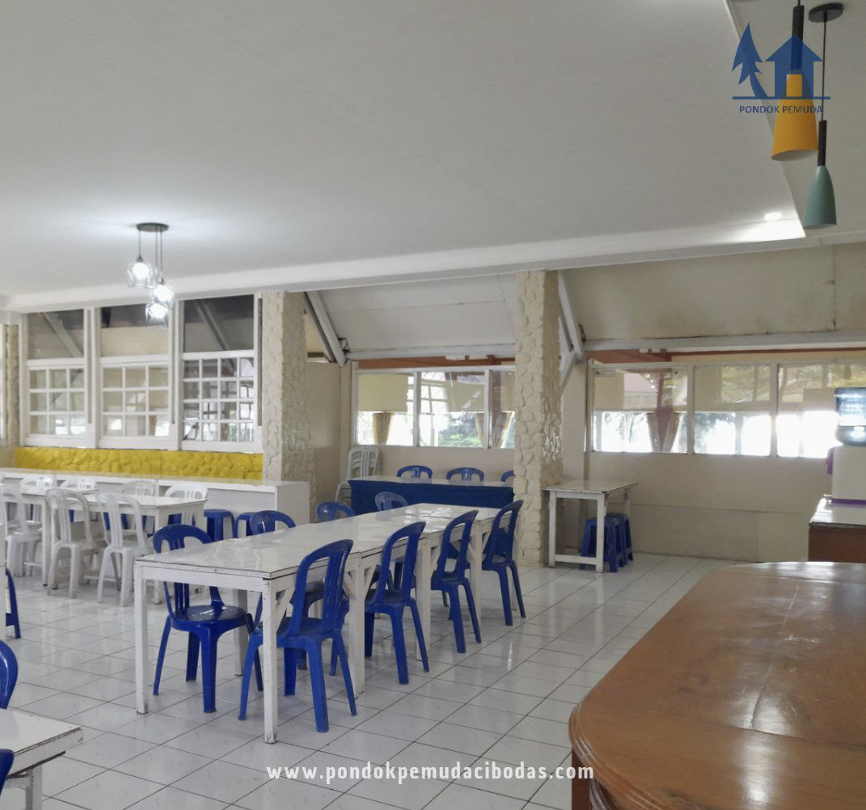 Modern fitness center with cardio machines and free weights