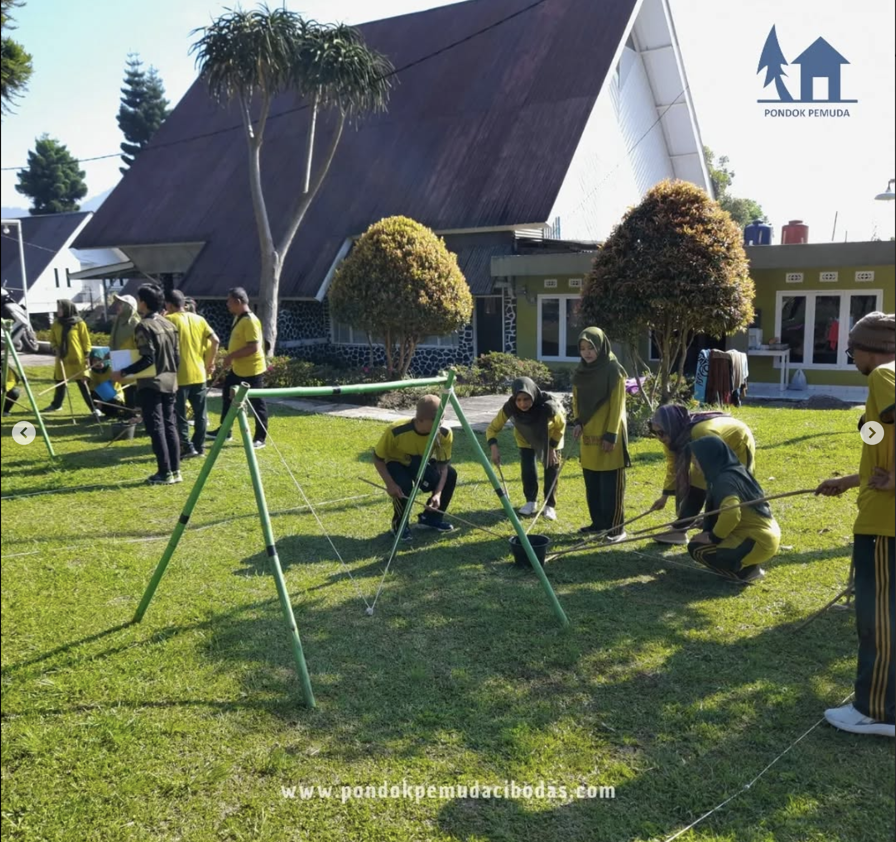 Infinity pool overlooking the ocean with lounge chairs and palm trees